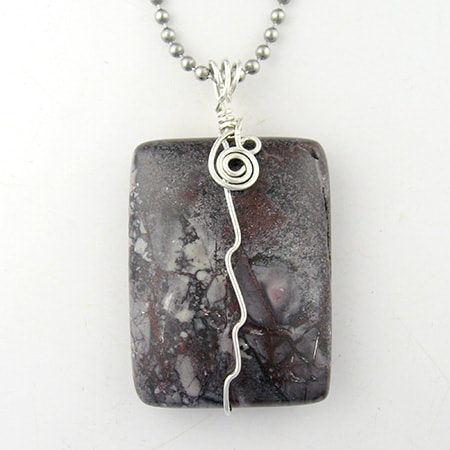 Porcelain jasper pendant wrapped with sterling wire.