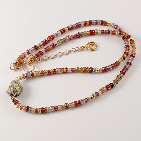 Multi-colored sapphire necklace with pyrite nugget.
